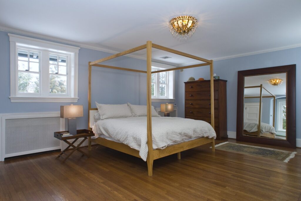 Interior of a master bedroom with blue walls