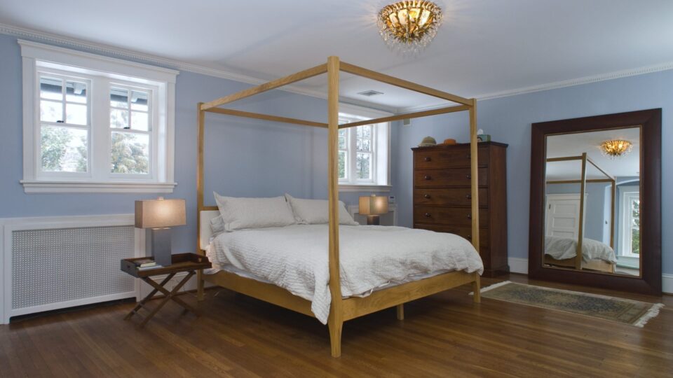 Interior of a master bedroom with blue walls