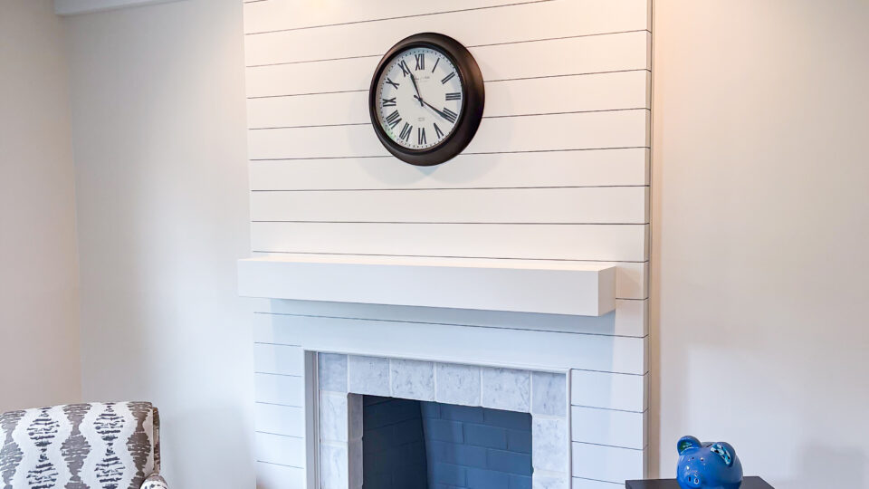 Nolan Painting carpentry team installs shiplap fireplace
